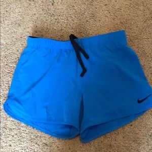 Blue nike running shorts